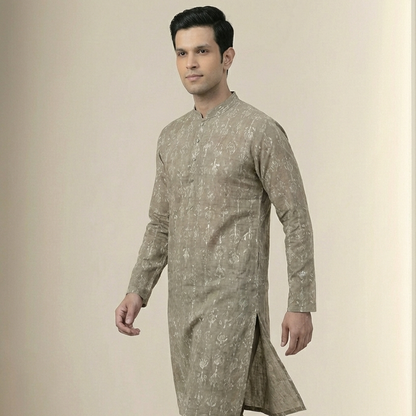 Man wearing a traditional kurta with a neutral background