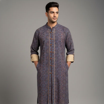 Man wearing a patterned kurta against a gray background
